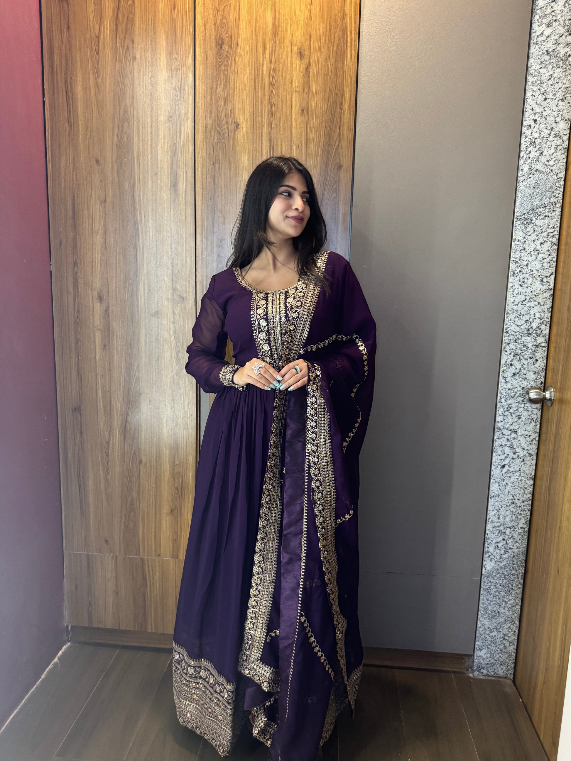ANCHOR VISHWA PANDYA IN PURPLE COLOR FAUX BLOOMING RICH SEQUENCE EMBROIDERED GOWN