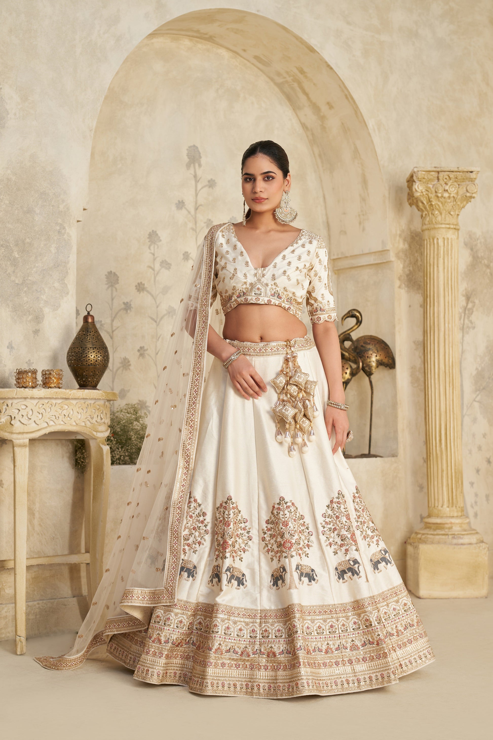 WHITE LEHENGA WITH INTRICATE ELEPHANT ZARI WORK – ROYAL FESTIVE WEAR