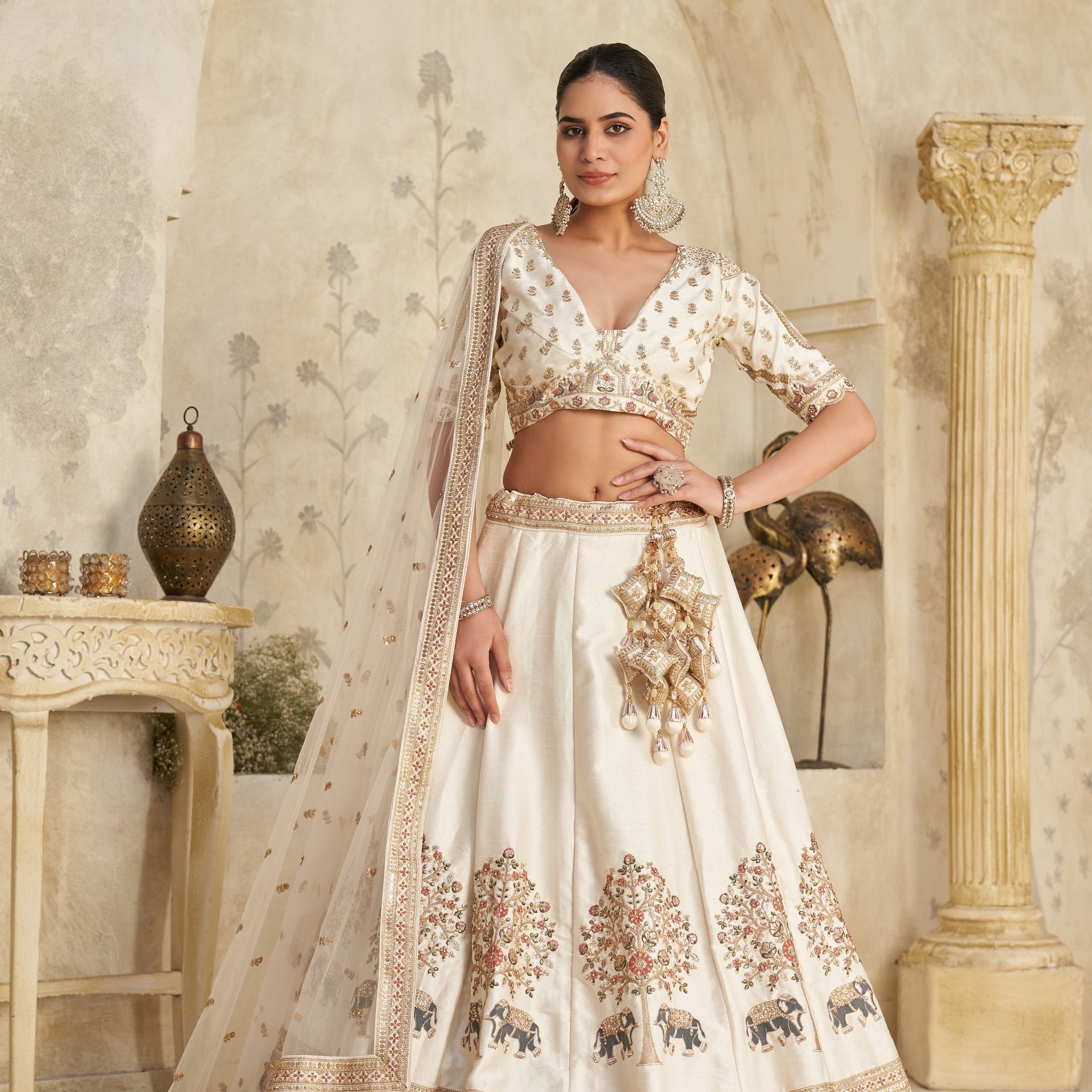WHITE LEHENGA WITH INTRICATE ELEPHANT ZARI WORK – ROYAL FESTIVE WEAR