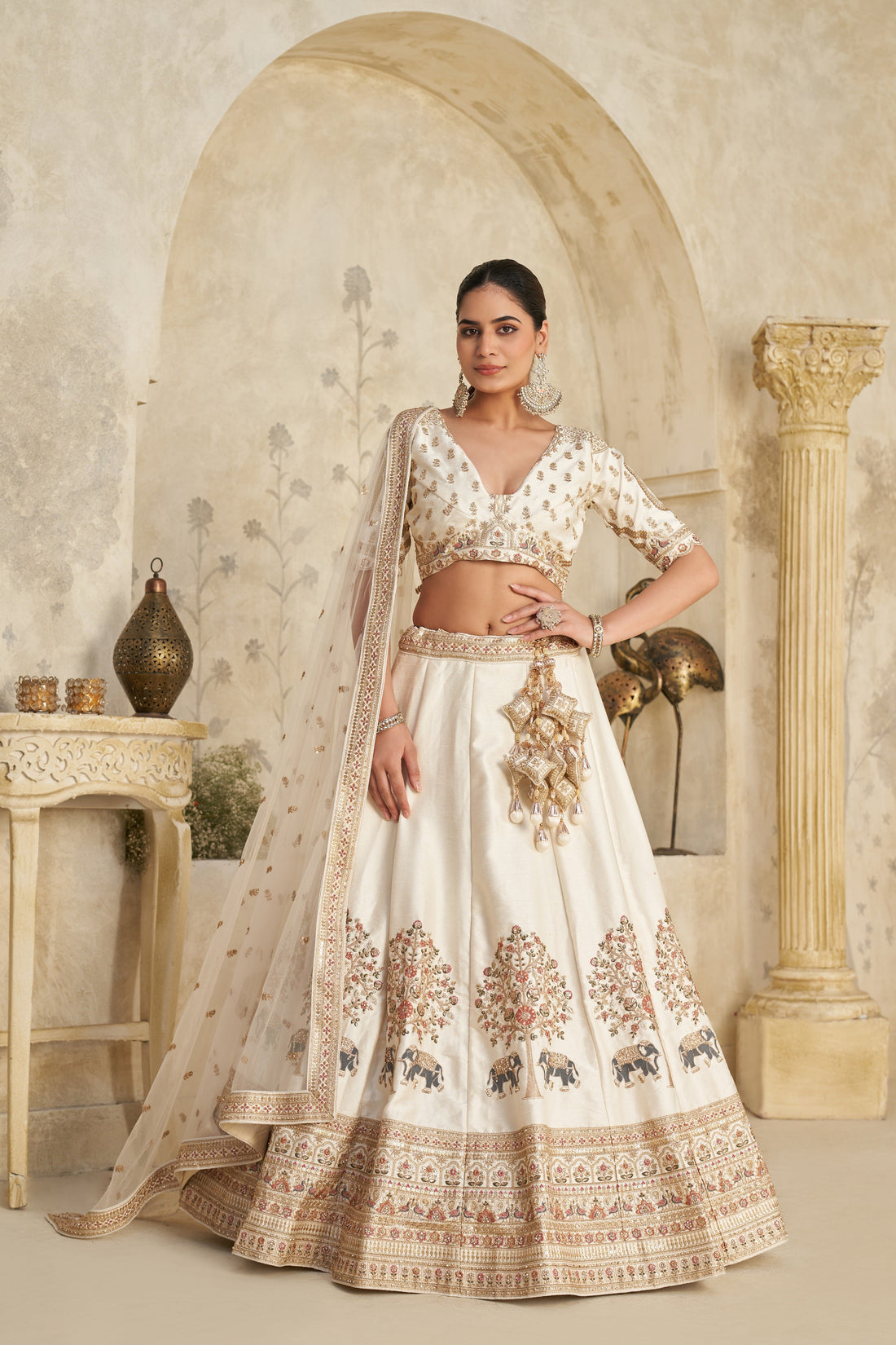 WHITE LEHENGA WITH INTRICATE ELEPHANT ZARI WORK – ROYAL FESTIVE WEAR