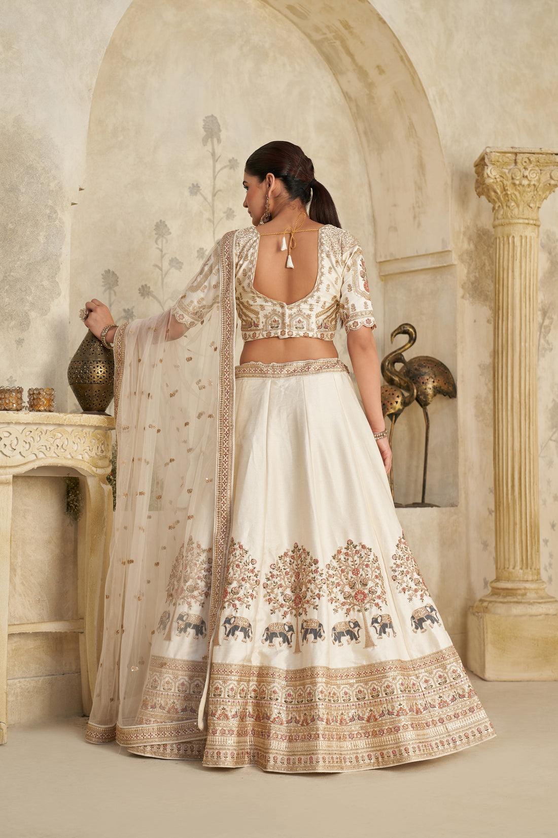 WHITE LEHENGA WITH INTRICATE ELEPHANT ZARI WORK – ROYAL FESTIVE WEAR
