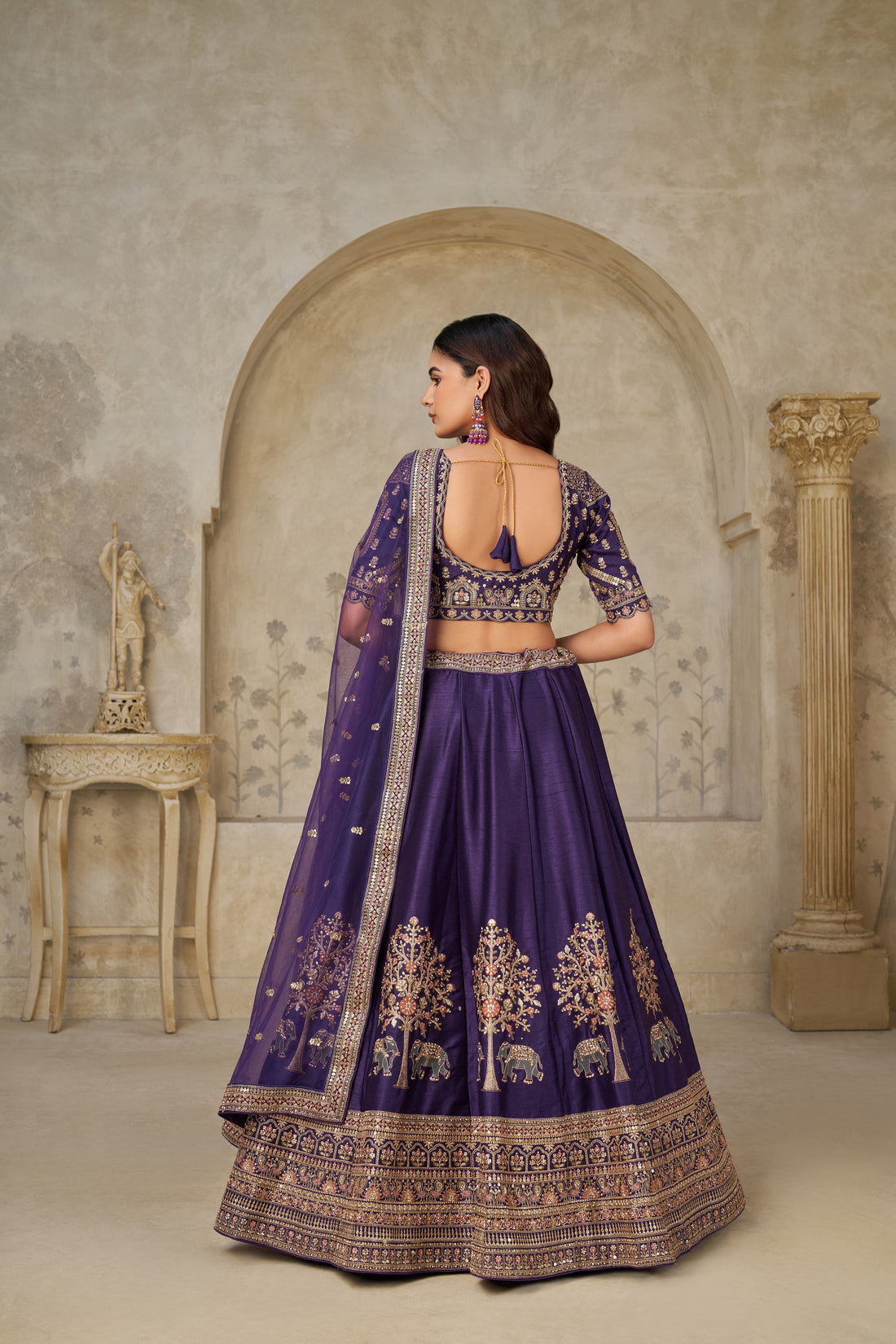 ROYAL PURPLE WEDDING LEHENGA WITH INTRICATE ELEPHANT MOTIFS