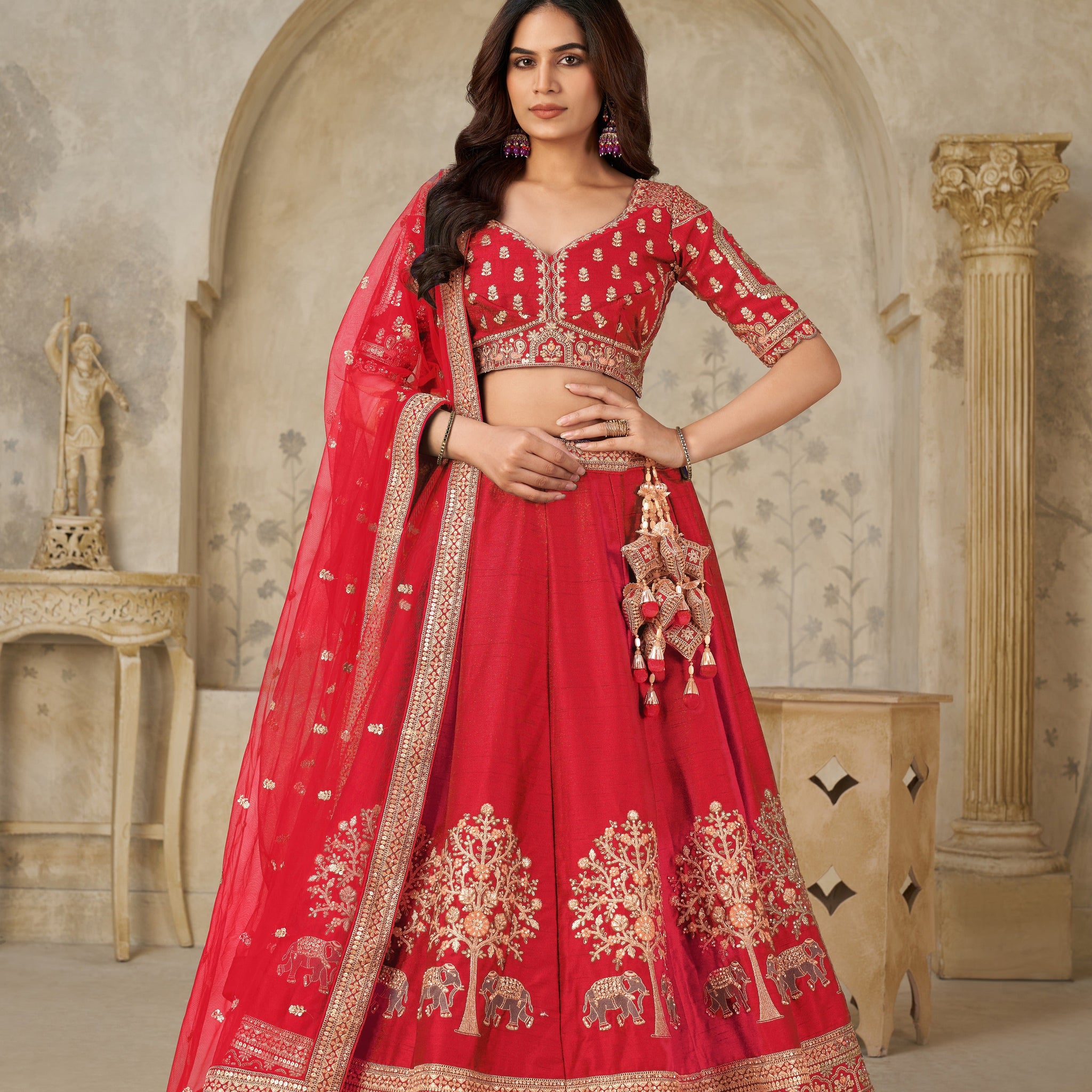 RED BRIDAL ENSEMBLE WITH ELEGANT ELEPHANT MOTIFS – ROYAL WEDDING WEAR
