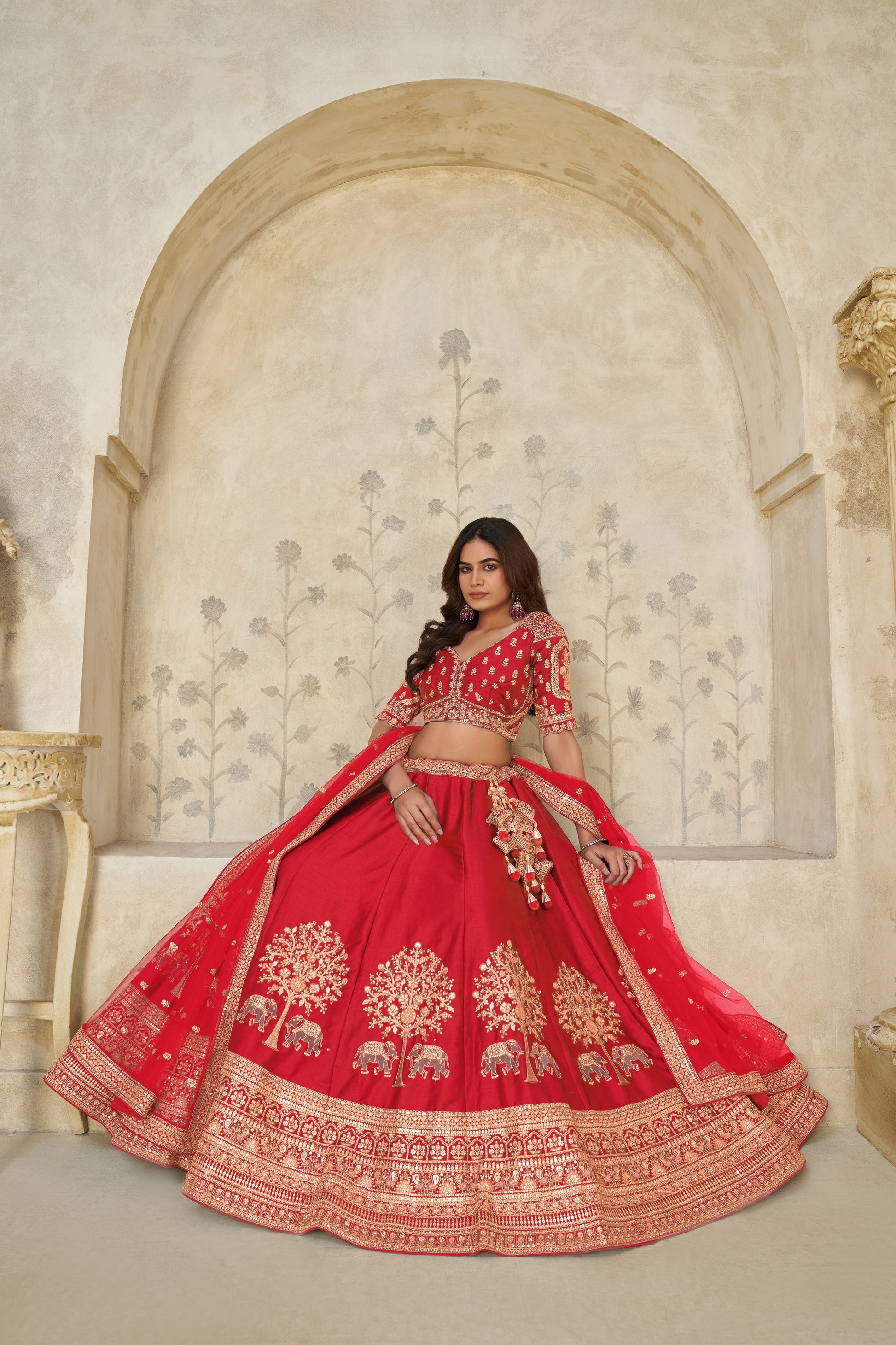 RED BRIDAL ENSEMBLE WITH ELEGANT ELEPHANT MOTIFS – ROYAL WEDDING WEAR