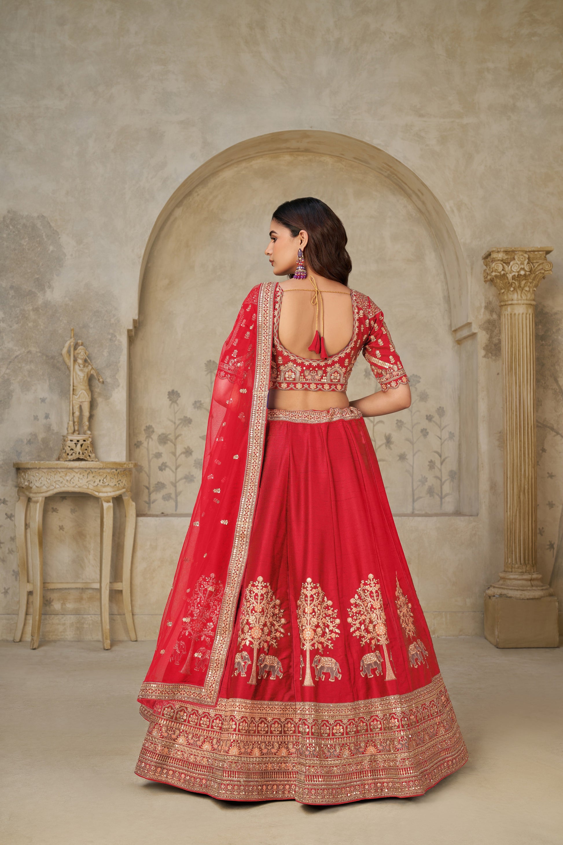 RED BRIDAL ENSEMBLE WITH ELEGANT ELEPHANT MOTIFS – ROYAL WEDDING WEAR