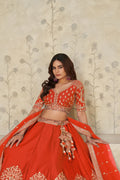 TRENDY RUST WEDDING LEHENGA WITH INTRICATE ELEPHANT MOTIFS