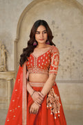TRENDY RUST WEDDING LEHENGA WITH INTRICATE ELEPHANT MOTIFS