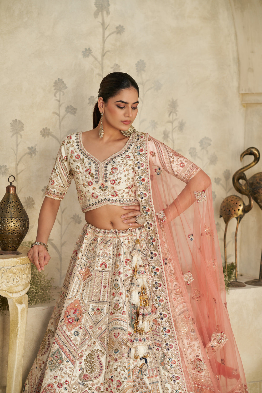 INTRICATELY EMBROIDERED CREAM ZARI LEHENGA WITH ROYAL MOTIFS