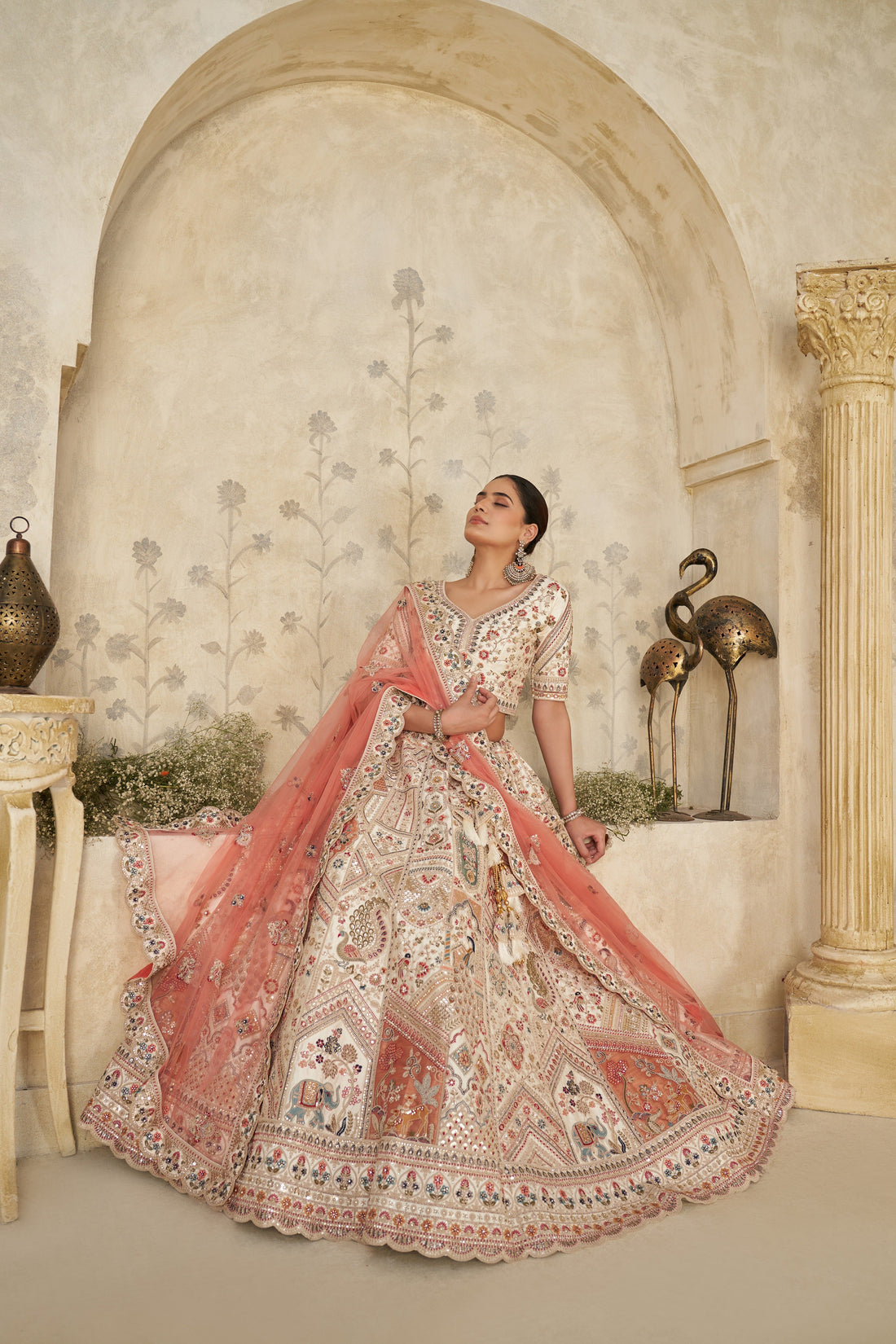 INTRICATELY EMBROIDERED CREAM ZARI LEHENGA WITH ROYAL MOTIFS