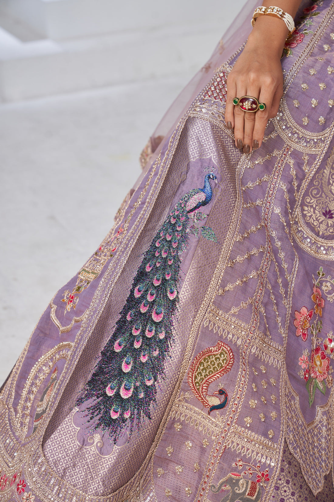 ROYAL RAW SILK PURPLE LEHENGA WITH PEACOCK FEATHER MOTIFS