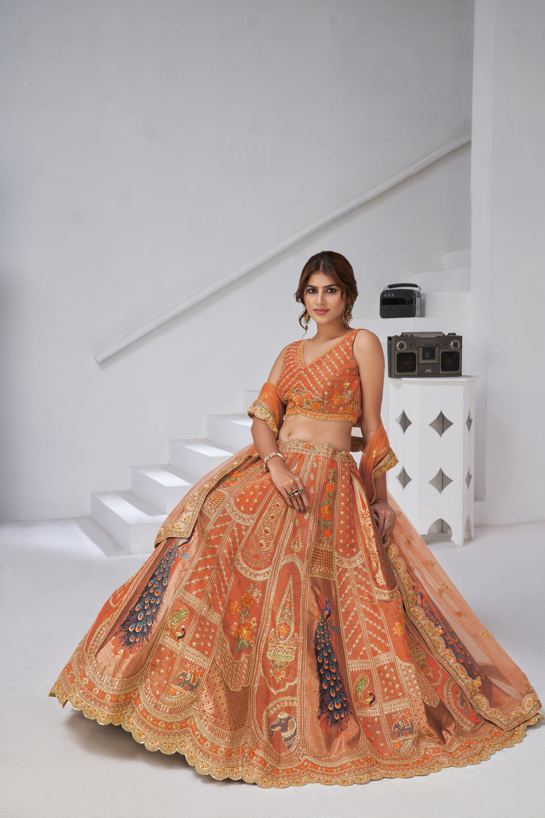 DESIGNER RUST RAW SILK LEHENGA WITH PEACOCK FEATHER WORK