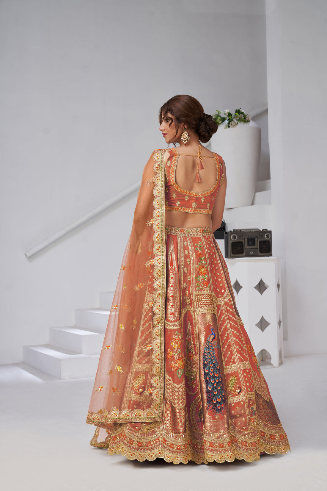 DESIGNER RUST RAW SILK LEHENGA WITH PEACOCK FEATHER WORK