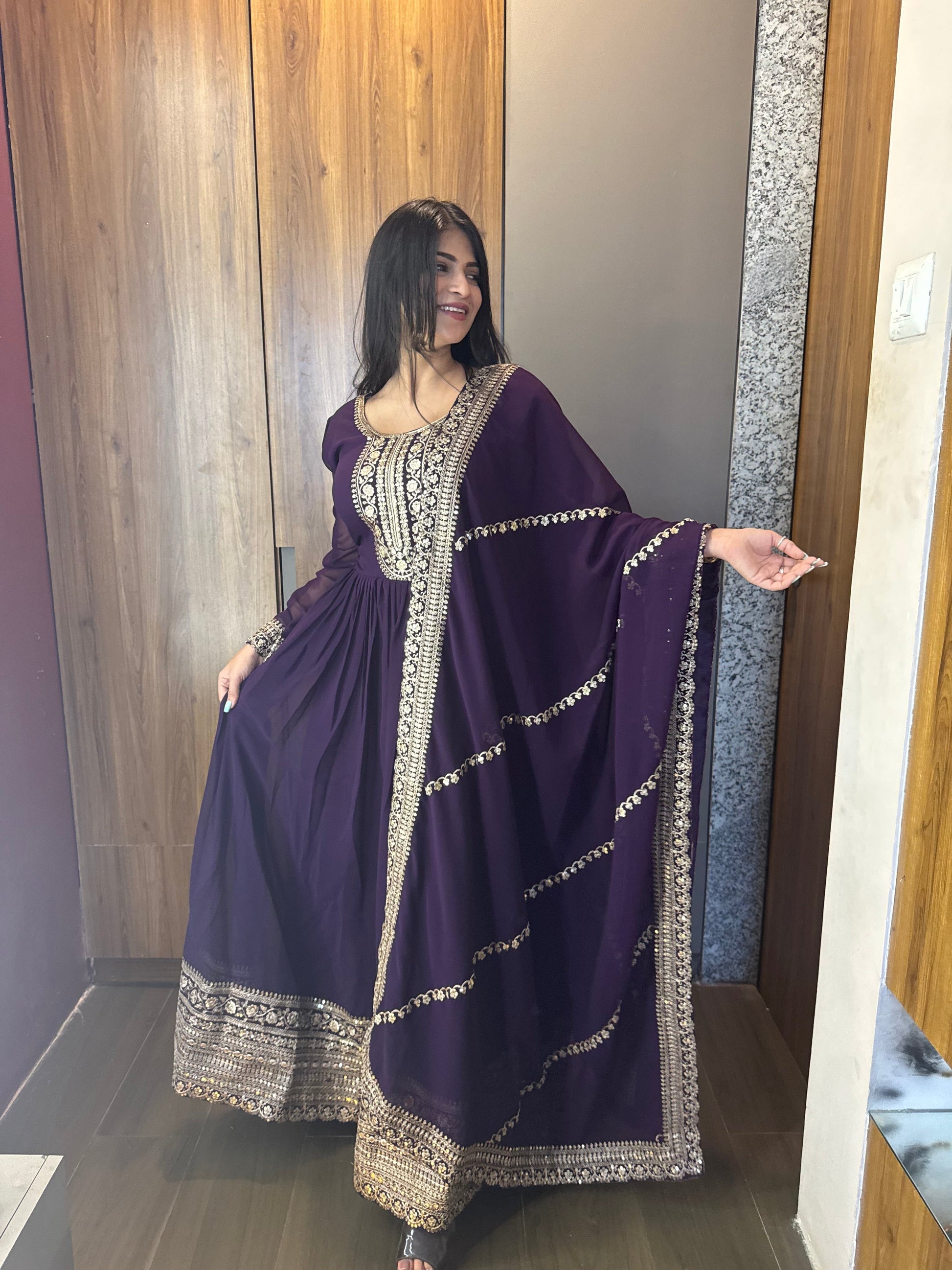 ANCHOR VISHWA PANDYA IN PURPLE COLOR FAUX BLOOMING RICH SEQUENCE EMBROIDERED GOWN
