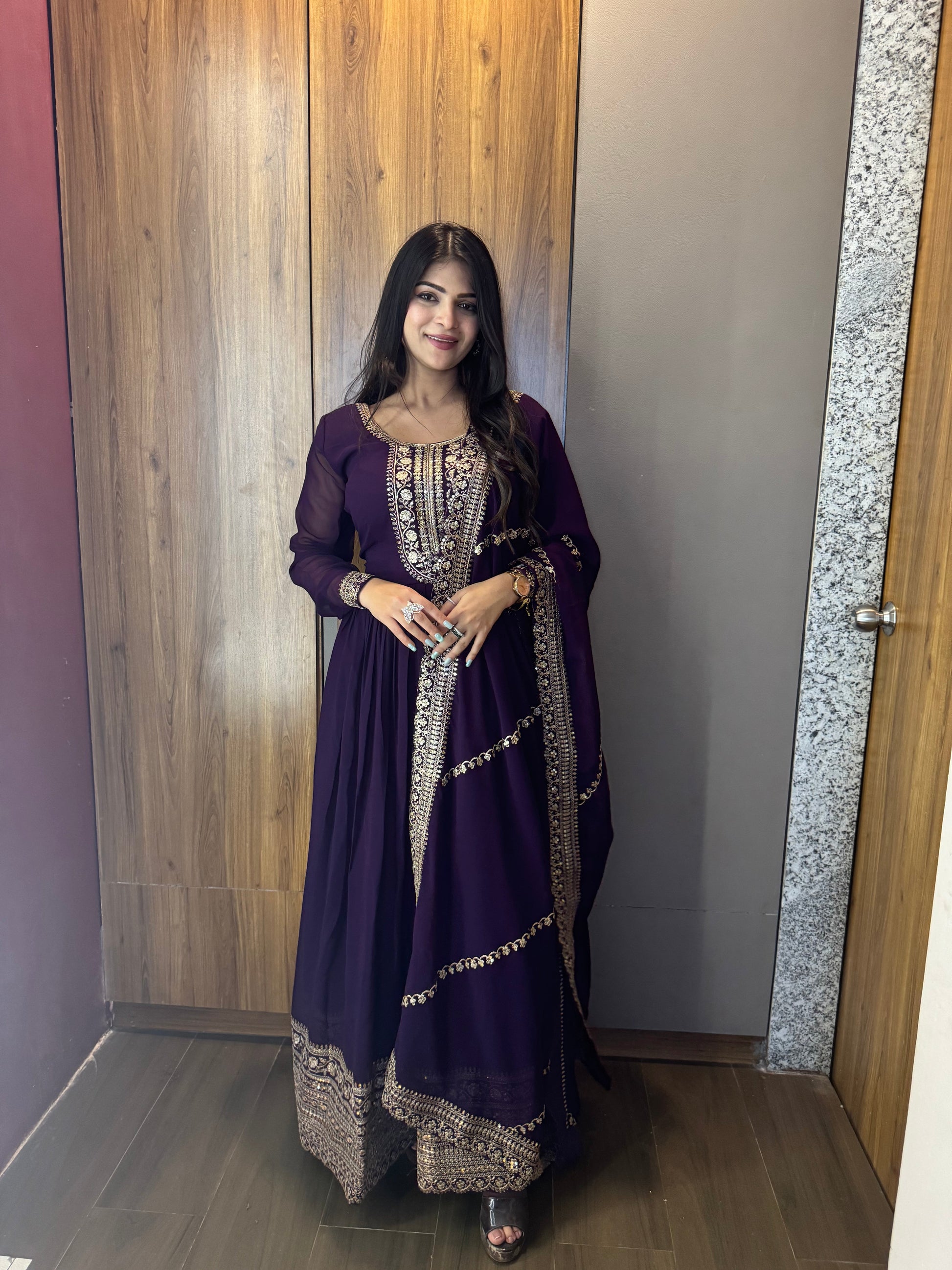 ANCHOR VISHWA PANDYA IN PURPLE COLOR FAUX BLOOMING RICH SEQUENCE EMBROIDERED GOWN