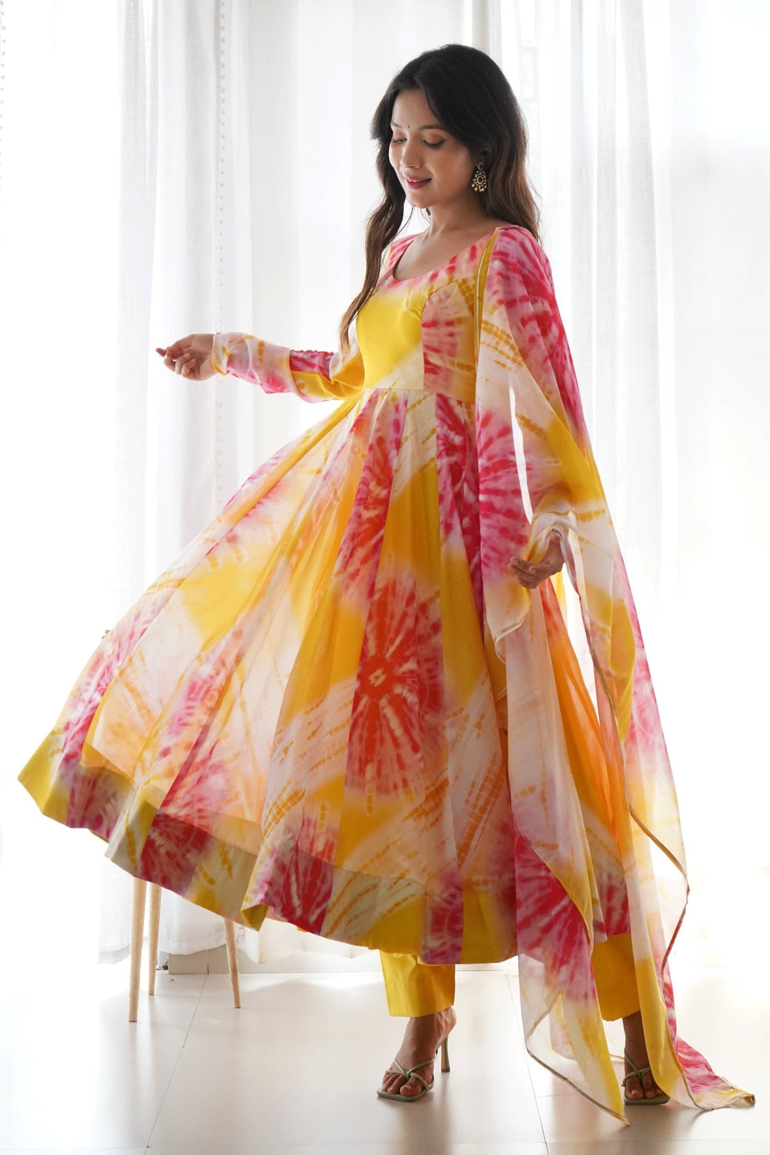 EXPERIENCE THE BEAUTY OF YELLOW ANARKALI WITH PINK FLOWER PRINT