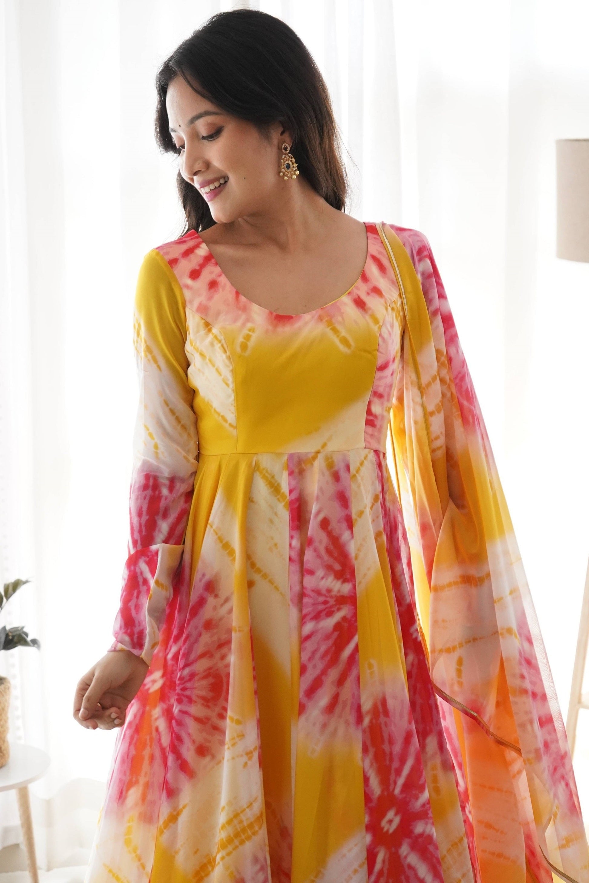 EXPERIENCE THE BEAUTY OF YELLOW ANARKALI WITH PINK FLOWER PRINT