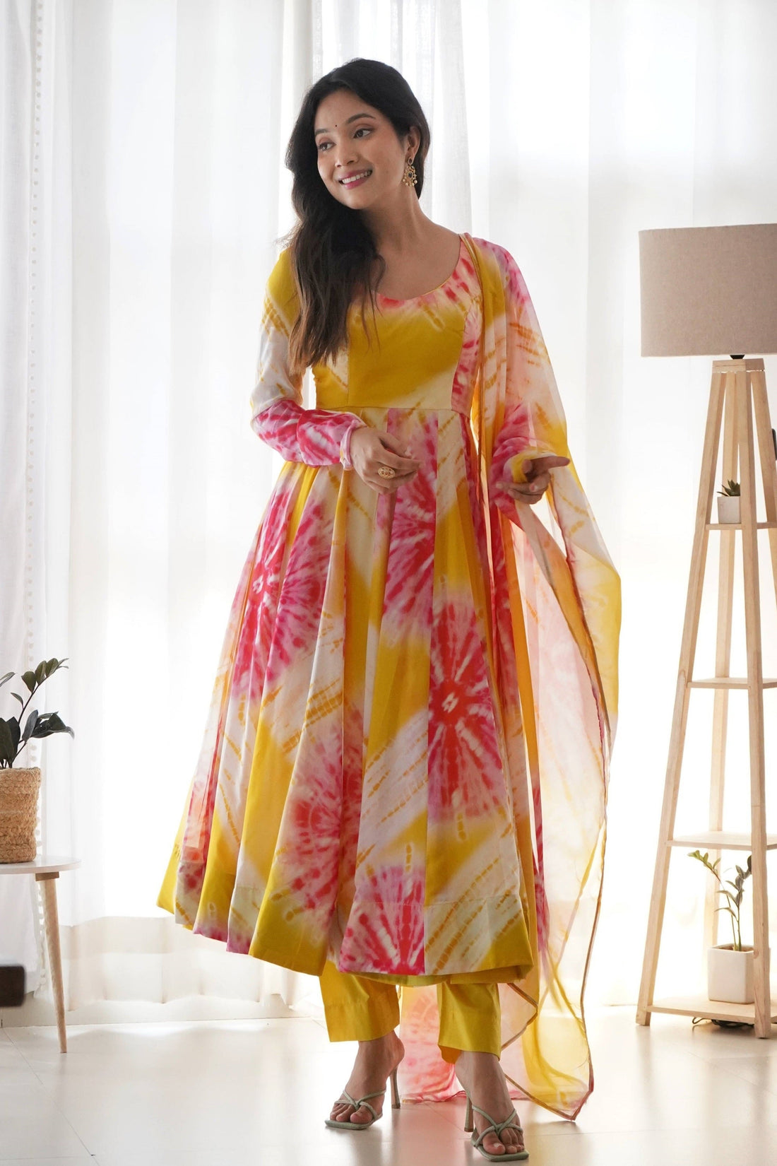 EXPERIENCE THE BEAUTY OF YELLOW ANARKALI WITH PINK FLOWER PRINT