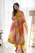 EXPERIENCE THE BEAUTY OF YELLOW ANARKALI WITH PINK FLOWER PRINT