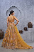 THE BAGH COLLECTION: MARVELOUS MUSTARD PEACOCK EMBROIDERED BRIDAL LEHENGA