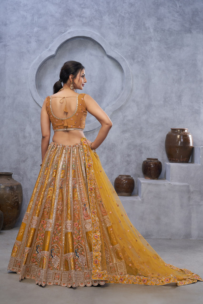 THE BAGH COLLECTION: MARVELOUS MUSTARD PEACOCK EMBROIDERED BRIDAL LEHENGA