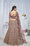 ROYAL GRANDEUR BRIDAL PURPLE SOFT NET LEHENGA WITH PAISLEY & PEACOCK MOTIFS AND HEAVY EMBROIDERY