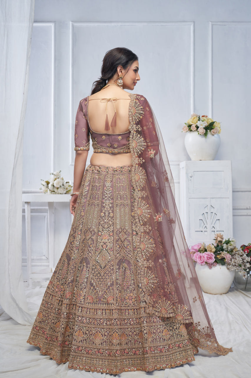 ROYAL GRANDEUR BRIDAL PURPLE SOFT NET LEHENGA WITH PAISLEY & PEACOCK MOTIFS AND HEAVY EMBROIDERY