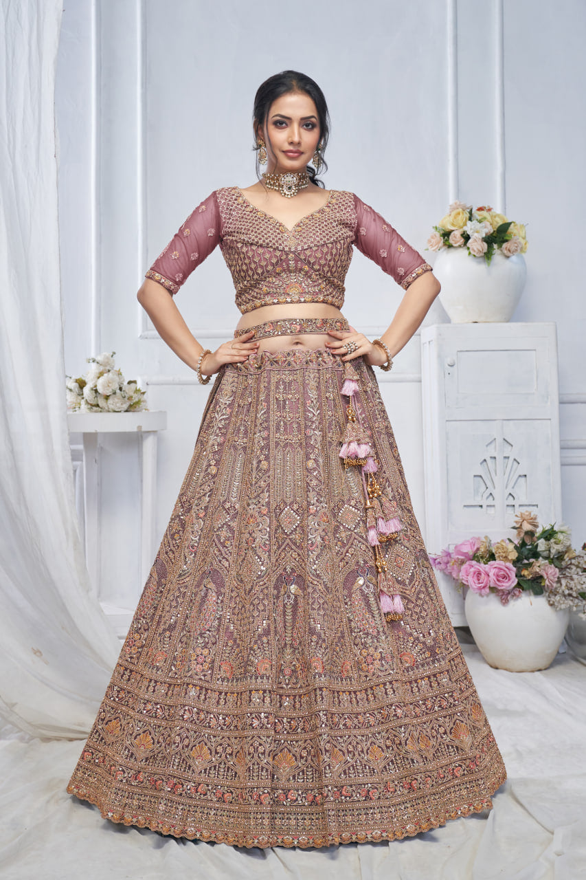 ROYAL GRANDEUR BRIDAL ONION-COLORED SOFT NET LEHENGA WITH PAISLEY & PEACOCK MOTIFS AND HEAVY EMBROIDERY