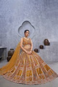 THE BAGH COLLECTION: MARVELOUS MUSTARD PEACOCK EMBROIDERED BRIDAL LEHENGA