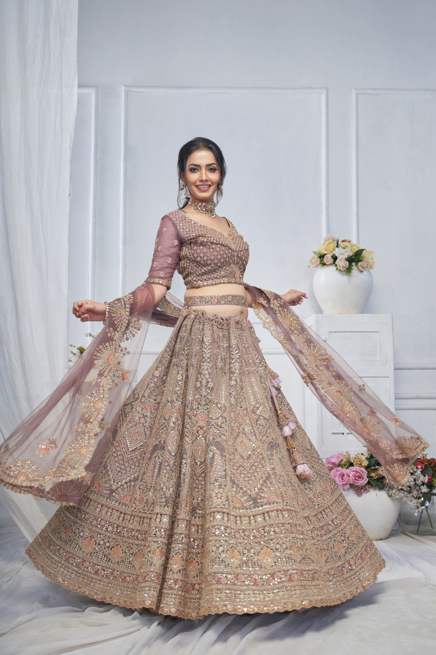 ROYAL GRANDEUR BRIDAL PURPLE SOFT NET LEHENGA WITH PAISLEY & PEACOCK MOTIFS AND HEAVY EMBROIDERY