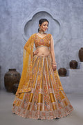 THE BAGH COLLECTION: MARVELOUS MUSTARD PEACOCK EMBROIDERED BRIDAL LEHENGA