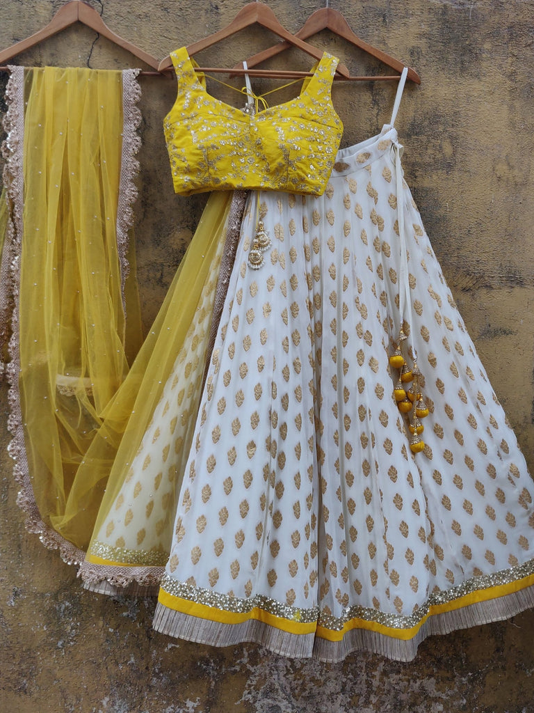 WHITE COLOR BANARASI SILK LEHENGA CHOLI WITH YELLOW NET DUPATTA